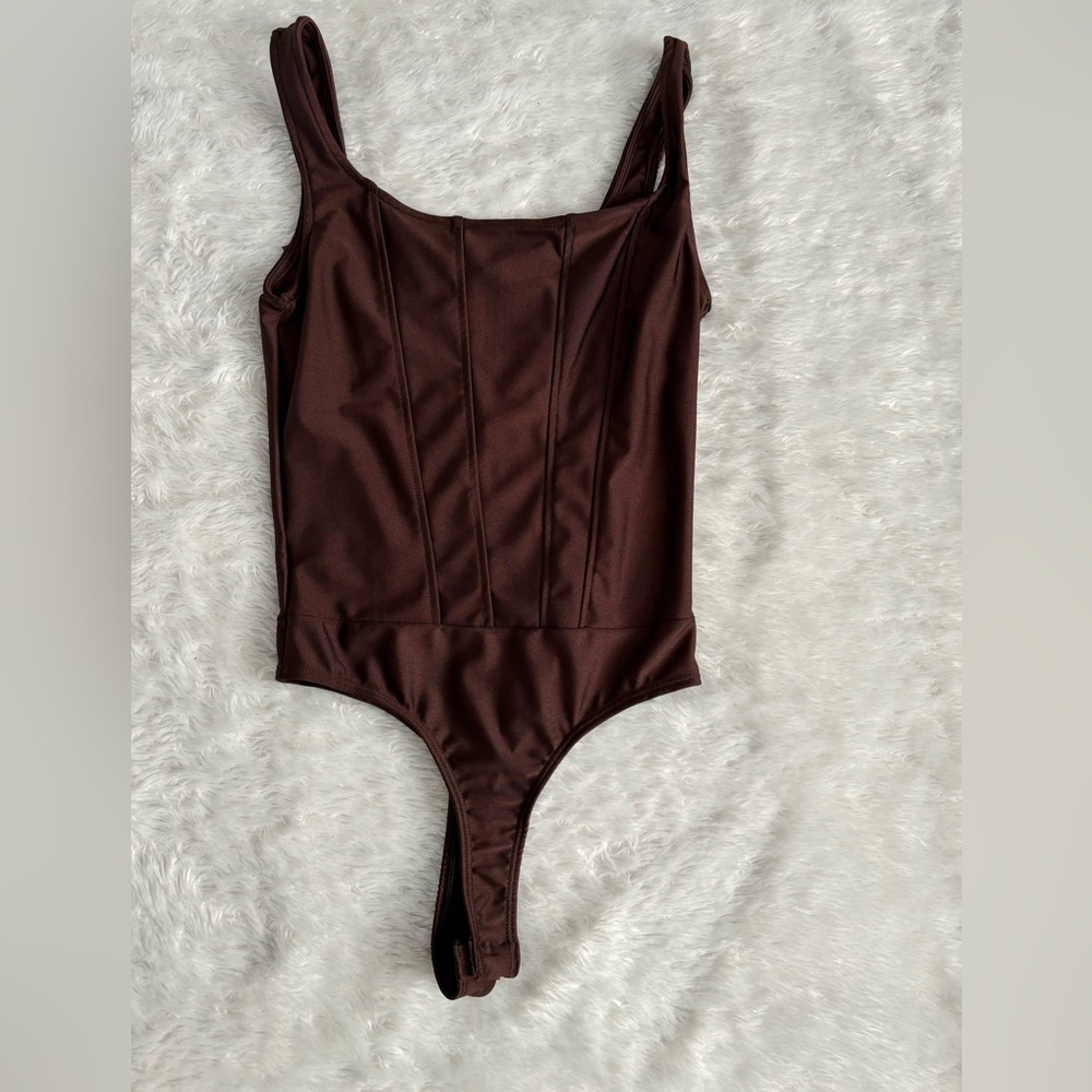 Corset like body suit.